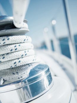 Sailboat winch and rope yacht detail. Yachting