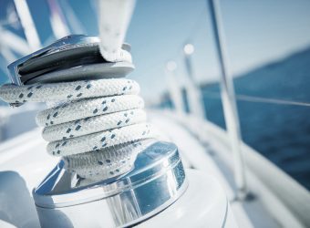 Sailboat winch and rope yacht detail. Yachting